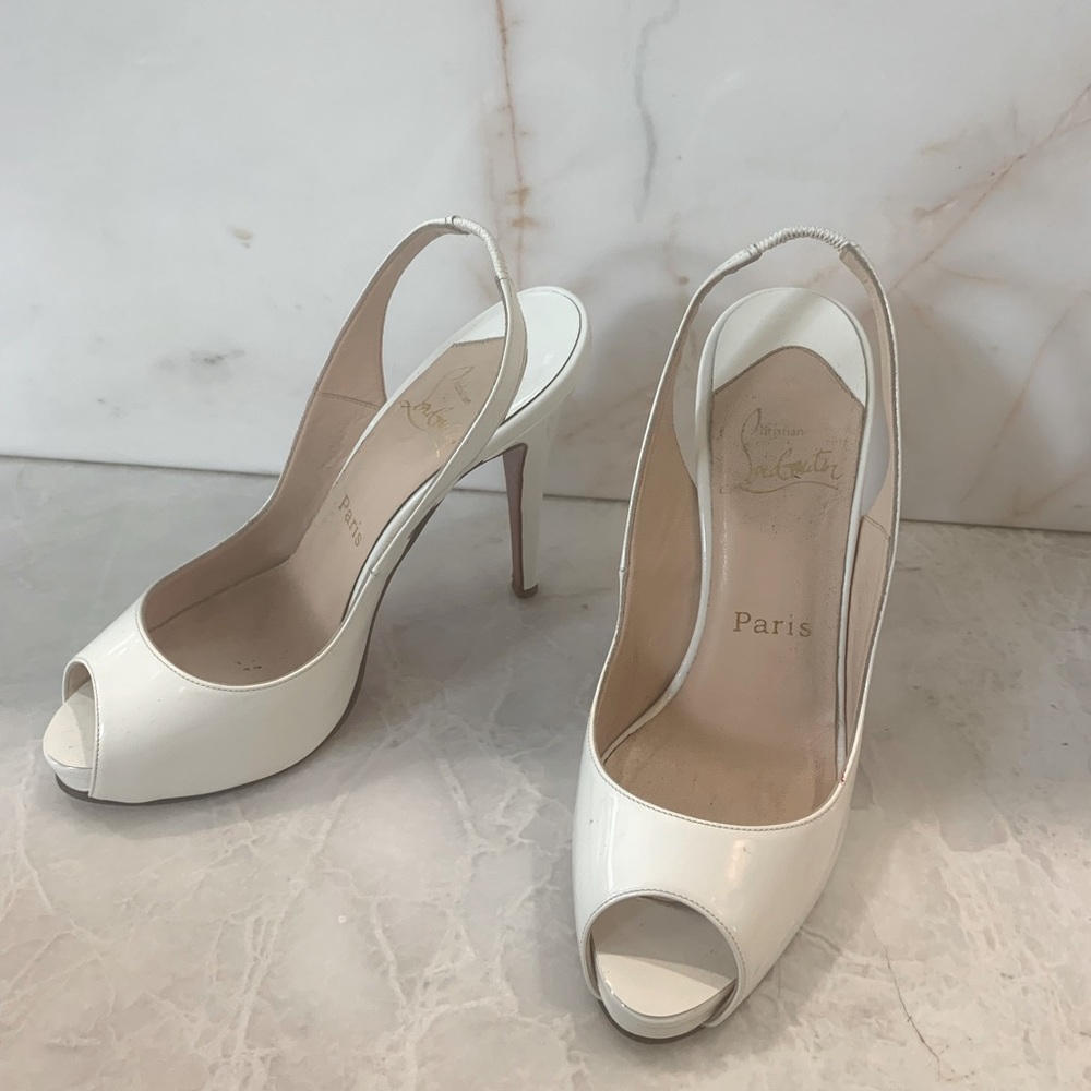 White lacquer Louboutin pumps